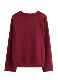 Bordeaux sweatshirt med rund halsudskæring, raglanærmer og ribstrikkede manchetter. Lavet af blødt, struktureret stof med en afslappet pasform.