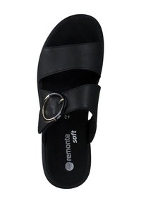 Sandale noire à glissière avec des sangles superposées, dotée d'un accent métallique circulaire. Fabriquée en cuir lisse avec une semelle intérieure douce et rembourrée.