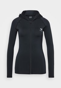 Felpa nera con zip, maniche lunghe, design aderente e piccolo logo bianco sul lato sinistro del petto. Tessuto liscio e elasticizzato.