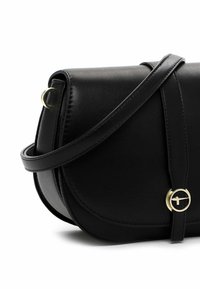 Black leather crossbody bag with a rounded shape, gold hardware accents, and a flap closure. Features a flat strap for shoulder wear.