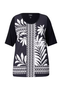 Top negro de manga corta con un patrón floral y geométrico en blanco en la parte frontal. Cuello redondo, tejido ligero y ajuste relajado.