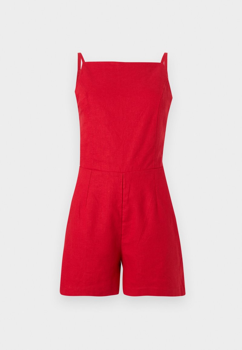 Red linen romper with thin straps, square neckline, and pleated front detail. Tailored fit with shorts, minimalistic design.