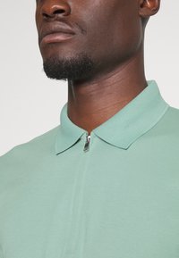 Selected Homme SLHFAVE ZIP - Polo - granite green