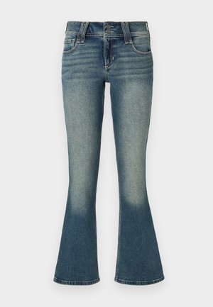 Mid-blue denim jeans with slight fading at thighs and flared legs, featuring front pockets, belt loops, and double-button closure.