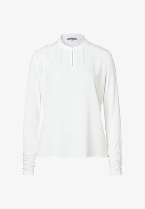 White long-sleeve shirt with a banded collar, keyhole neckline, and gathered sleeve details. Smooth fabric, relaxed fit, and minimal design.