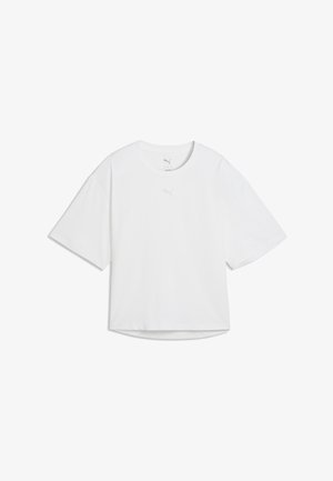 T-shirt blanc à manches courtes en tissu lisse, avec un col rond et un logo discret sur la poitrine. Coupe carrée avec des manches larges.