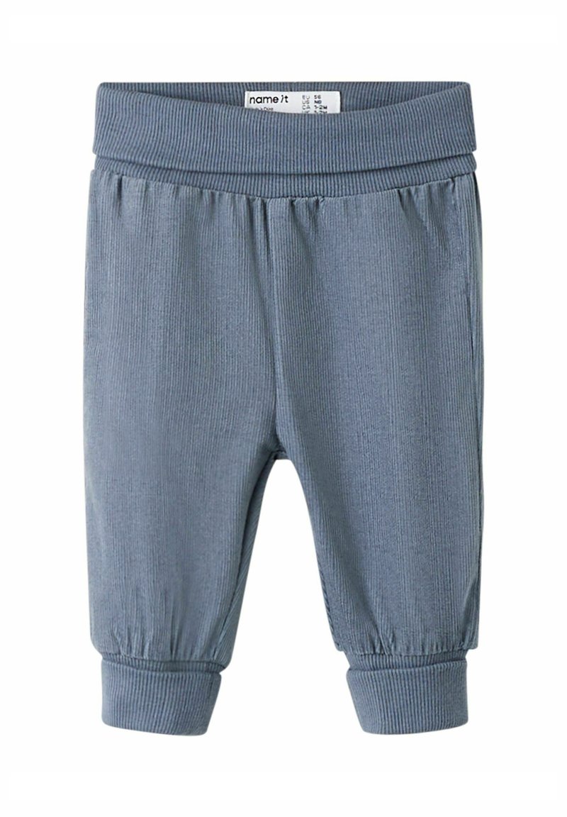 Light blue ribbed cotton pants with an elastic waistband and cuffed ankles, featuring a soft texture and a relaxed fit.