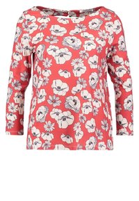 Rode bloemmotieven met lange mouwen top met witte en zwarte bloemenpatronen, ronde halslijn en een ontspannen pasvorm. Zacht materiaal met een gladde textuur.