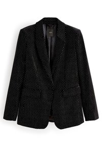 Blazer en velours noir à pois blancs, avec revers en encoche et deux poches avant. Texture lisse et coupe ajustée. Étiquette intérieure visible.