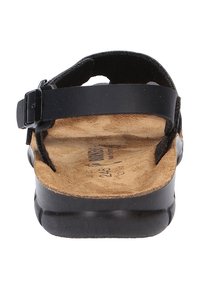 Schwarze Sandale mit Schnallenriemen, Korkfußbett und strukturiertem Gummisohle. Verfügt über ein oberes Leder und ein minimalistisches Design.