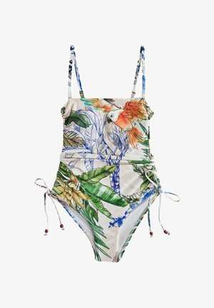 One-piece swimsuit with thin straps, side ties, featuring colorful tropical leaves and an orange parrot print on a light background.