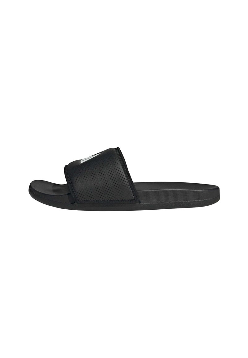 Black slide sandals made of perforated synthetic material. Features a wide strap and a smooth sole for comfort and stability.