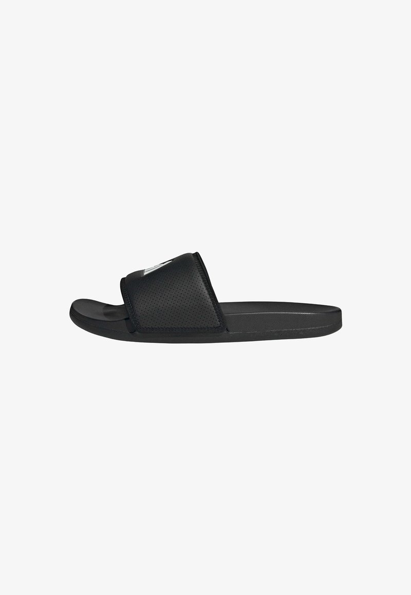 Black slide sandals made of perforated synthetic material. Features a wide strap and a smooth sole for comfort and stability.