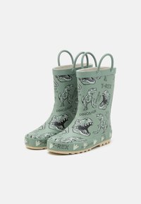 Bottes de pluie vertes pour enfants avec des illustrations de dinosaures, du texte T-Rex et des poignées pour un enfilage facile.