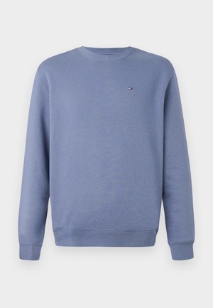 Sweat-shirt en coton bleu avec un col rond, des poignets côtelés et un ourlet inférieur. Présente un petit logo brodé sur la poitrine.