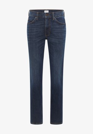 Tumši zili džinsa bikses ar taisnu kāju piegriezumu, piecas kabatas un kontrastējošu oranžu diegu šuvēs un kabatās.