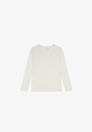 Langsleeve V-hals shirt in zachte, lichte beige stof met een gladde textuur en minimale naden. Basisontwerp zonder zichtbare patronen of versieringen.