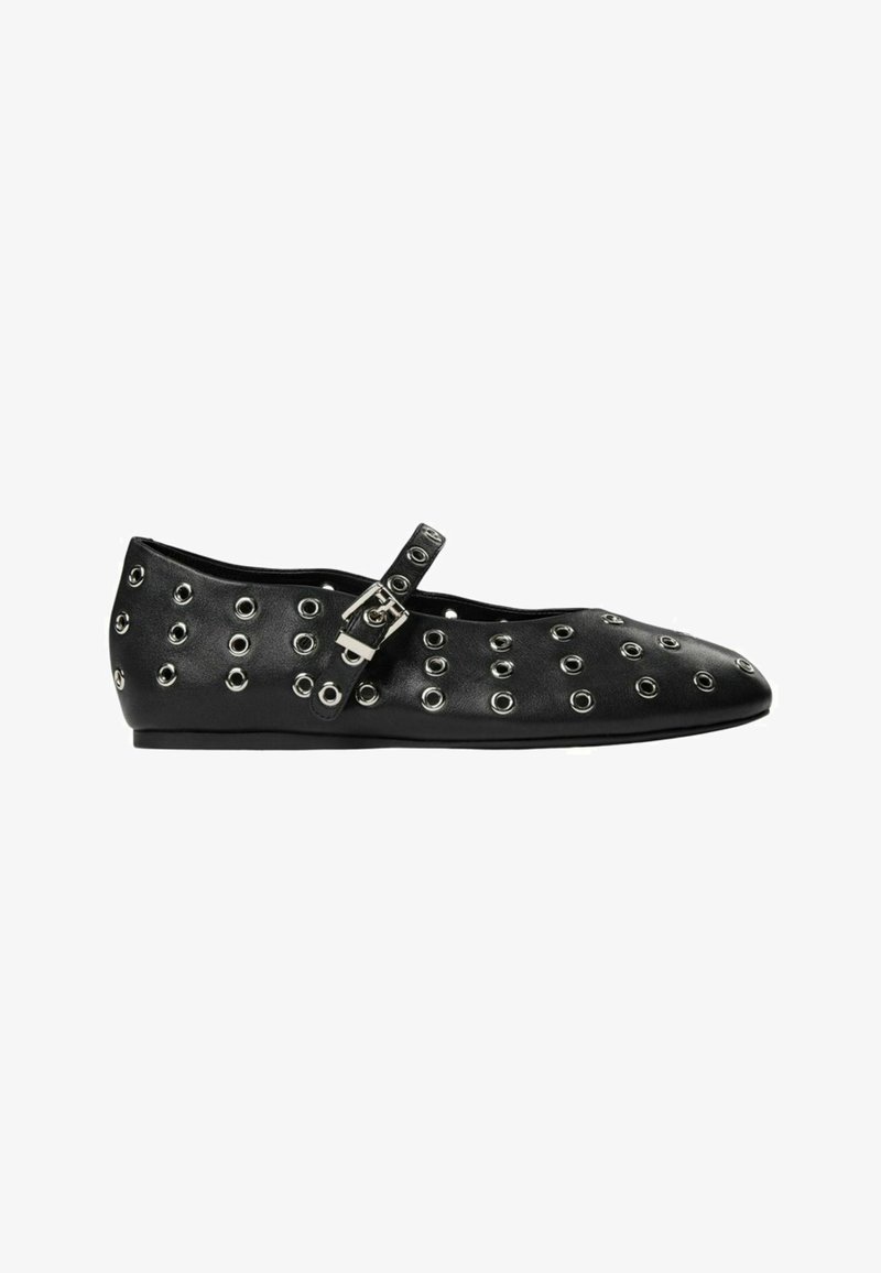 Black leather flats with silver eyelet detailing, a strap with a buckle, pointed toe design, and a flat sole. Smooth texture.