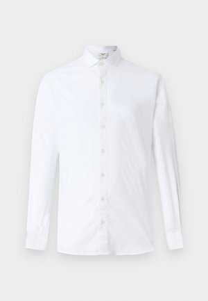 Chemise à manches longues blanche en coton, dotée d'un col classique, d'une coupe droite et d'une texture lisse avec des boutons assortis.
