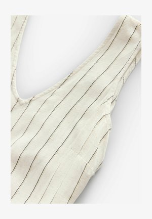 Top in lino con scollatura a barca, caratterizzato da righe verticali in beige e nero. Leggera texture, design senza maniche con dettagli di cucitura discreti.