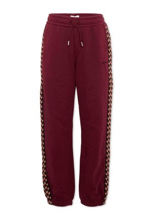 Bordeaux sweatpants met elastische taille en boorden, een trekkoord, en meerkleurige, met patronen versierde strepen aan de buitenkant van beide benen.