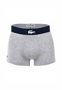 Boxer-chaussettes en coton gris avec une taille élastique bleu marine arborant un logo Lacoste blanc et une texture lisse. Coupe classique, conception taille mi-haute.
