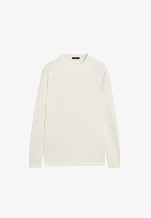 Chemise à manches longues et col rond de couleur blanc cassé, confectionnée dans un tissu doux à la texture lisse, présentant un design simple et épuré.