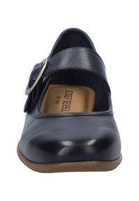 Navy blue leather Mary Jane shoes with a round toe, ankle strap, and circular metal buckle. Textured sole for grip.