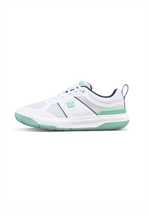 Weißer niedriger Sportschuh mit mintgrüner Sohle und Akzenten, marineblauer Innenausstattung und Schnürdesign.