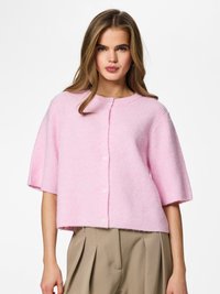 Short pink cardigan made of soft, ribbed material with a round neckline, short sleeves, and two white buttons down the front.