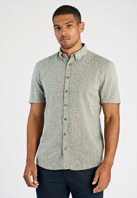 Korte mouwen overhemd met knopen in lichtgroene geappliqueerde stof, met een puntige kraag en donkere knopen, in een comfortabele pasvorm.