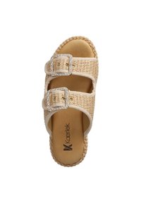 Beige slide sandal with woven upper, two adjustable straps featuring rhinestone buckles, and a textured braided sole.