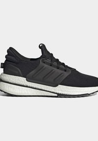 Zapatilla deportiva negra con parte superior de tejido texturizado, entresuela moldeada, amortiguación blanca y suela de goma negra con patrones de relieve distintos.