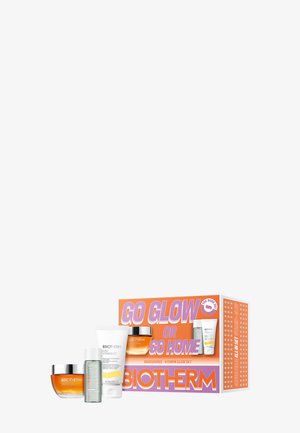 Biotherm Aquasource Vitamin Glow Set mit Creme, Mizellwasser, Feuchtigkeitscreme und orange-weißer Verpackung mit dem Text "Go Glow or Go Home".