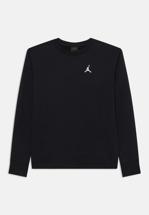 Melnā kapucīna krekls, kas izgatavots no kokvilnas maisījuma, ar apaļu kakla izgriezumu, garām piedurknēm un balto Jumpman logo uz krūšu daļas. Gluda tekstūra.