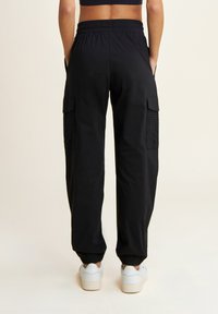Freddy IN CON RICAMI SANGALLO SULLE TASCHE - Pantaloni - nero