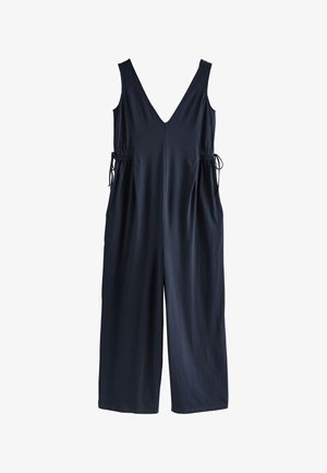 Combinaison sans manches bleu marine foncé avec un profond décolleté en V, jambes larges et liens latéraux ajustables à la taille, en tissu doux.