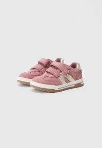 Pink suede shoes with beige accents, featuring two Velcro straps and a rubber sole. Detailed with white stripes and a textured finish.