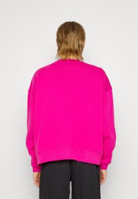 WRSTBHVR Sudadera - pink