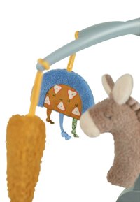 Colorful plush toys hang from a light blue arch. One is a brown donkey, and the other is a patterned soft fabric with pears. The texture is fluffy.