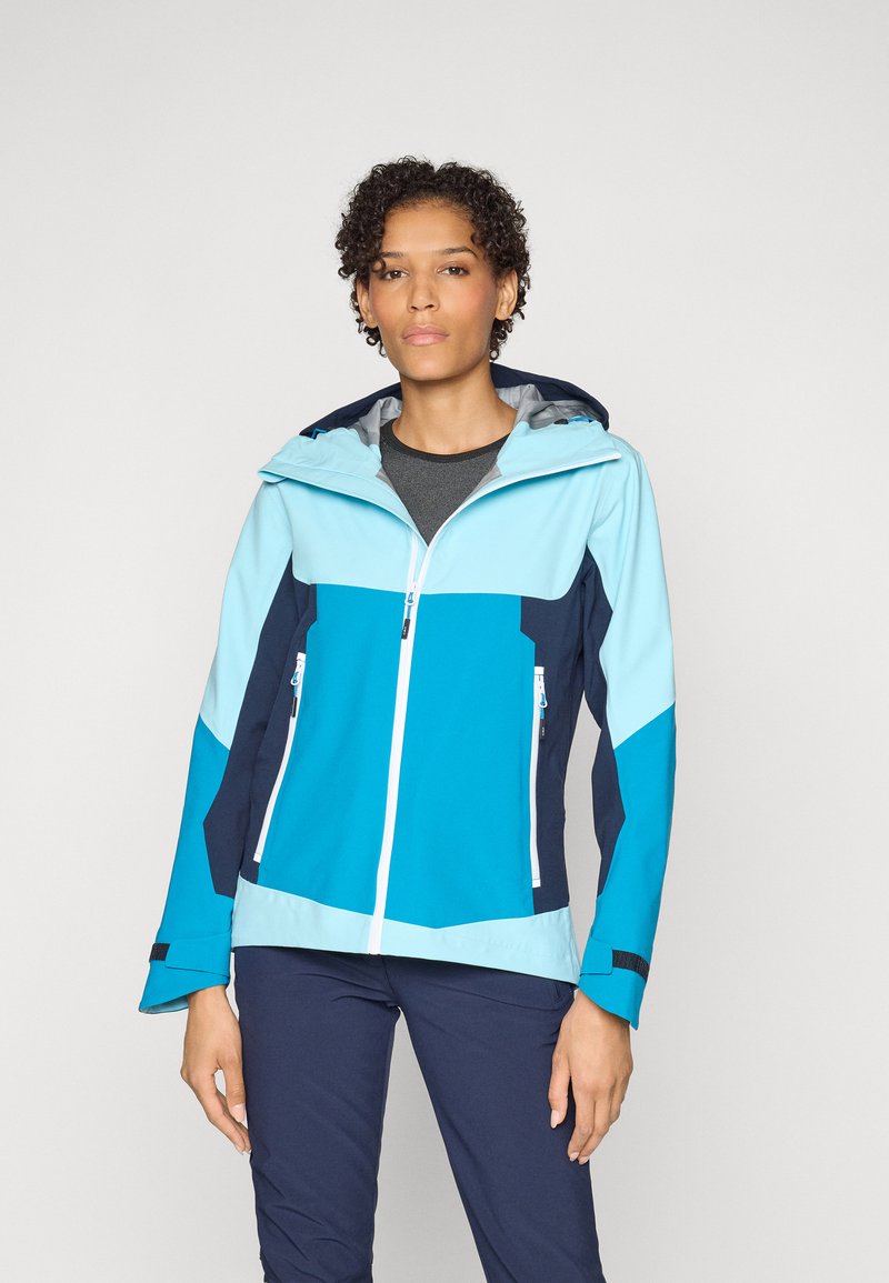Wasserdichte Jacke mit blauen und hellblauen Paneelen, Kapuze, Reißverschluss-Taschen und elastischen Bündchen, aus leichtem, atmungsaktivem Material hergestellt.