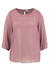 Blouse rose à manches 3/4, avec des motifs de points texturés et une fermeture par ouverture en forme de clé à l'arrière. Tissu doux avec une coupe légèrement ample.