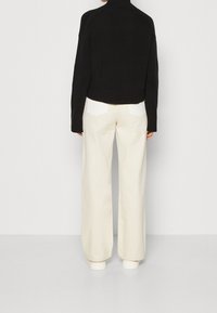 Calvin Klein Jeans Stickad tröja - black