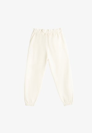 Pantalons de survêtement en polaire blancs avec taille élastique et poignets, coupe décontractée, adaptés à un usage quotidien.