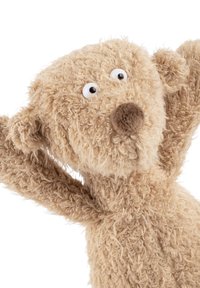 Tan plush teddy bear with textured, fuzzy fur and a rounded head. Features large, white button eyes and a brown nose. Arms raised.