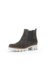 Tmavě zelená semišová kotníková bota s elastickými bočními panely, bílou robustní podrážkou a jemnými detaily šití. Ideální pro neformální nošení.