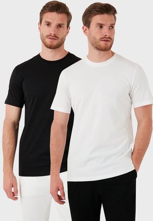 Sort og hvid crew neck t-shirts, korte ærmer, lavet af blødt bomuldsstof, med en almindelig pasform og glat tekstur.