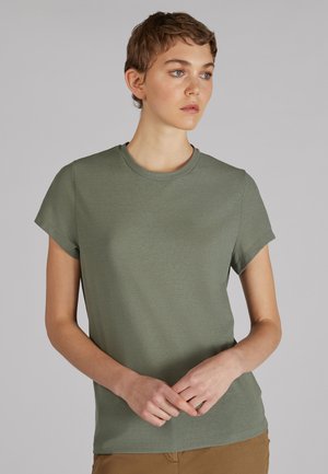 T-shirt met korte mouwen en ronde hals in een gedempt olijfgroen. Gemaakt van zachte, gestructureerde stof met een ontspannen pasvorm. Eenvoudig ontwerp, geen patronen.