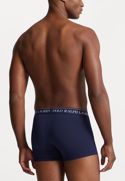 Boxers bleu marine avec une coupe ajustée, ceinture élastique arborant le logo "POLO RALPH LAUREN", fabriqués en tissu doux et lisse.