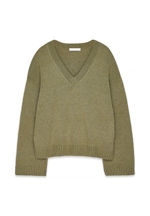 Alyvuogių žalumo megztinis su V formos iškirpte, krintančiomis petnešomis ir kutais ant rankovių bei apačios. Minkštas audinys, laisvas, trumpas siluetas.